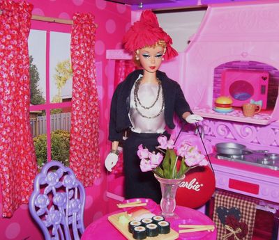 Barbie's new curtains.  She doesn't look impressed.  She says she wants a whole new wall.  I told her she needs to find a new carpenter.